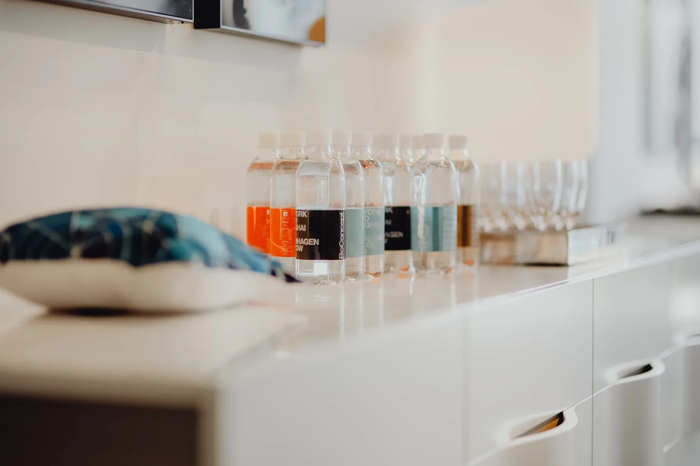 Consumer health and dermo-cosmetics product bottles arranged on a countertop